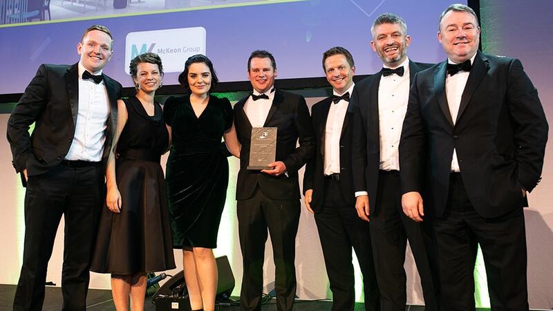 Tomás G. Mac Eoin, Managing Director, McKeon Group presents the Fit Out Project of the Year - Hospitality award to the Henry J Lyons team