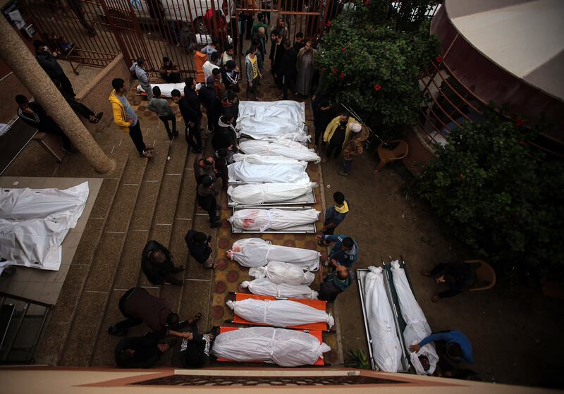 The bodies of people killed  in Israeli airstrikes are brought to the morgue at Nasser Hospital in Khan Younis. Photograph: Yousef Masoud/New York Times
                      