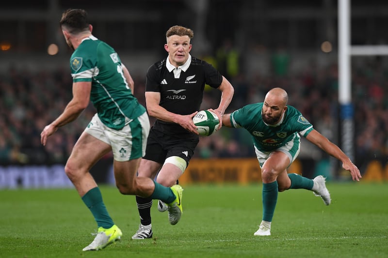 Damian McKenzie of New Zealand and Jamison Gibson-Park of Ireland. Photograph: Charles McQuillan/Getty