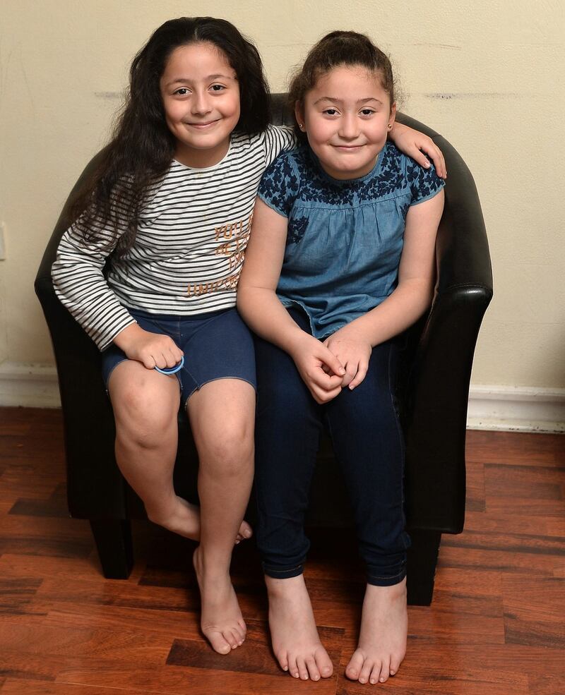 Aya (left) and Fatima at their Belfast home. Photograph: Colm Lenaghan/Pacemaker