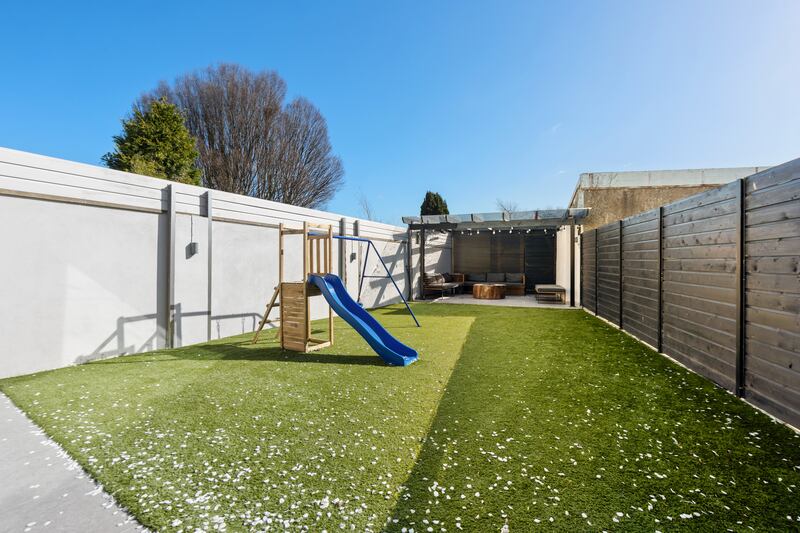 Garden with covered seating area at end