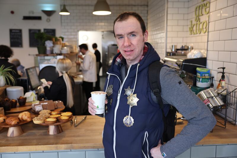 Stephen Lyons, who works at the Green Kitchen and Garden Shop, having his hot chocloate after finishing work. Photograph: Dara Mac Dónaill