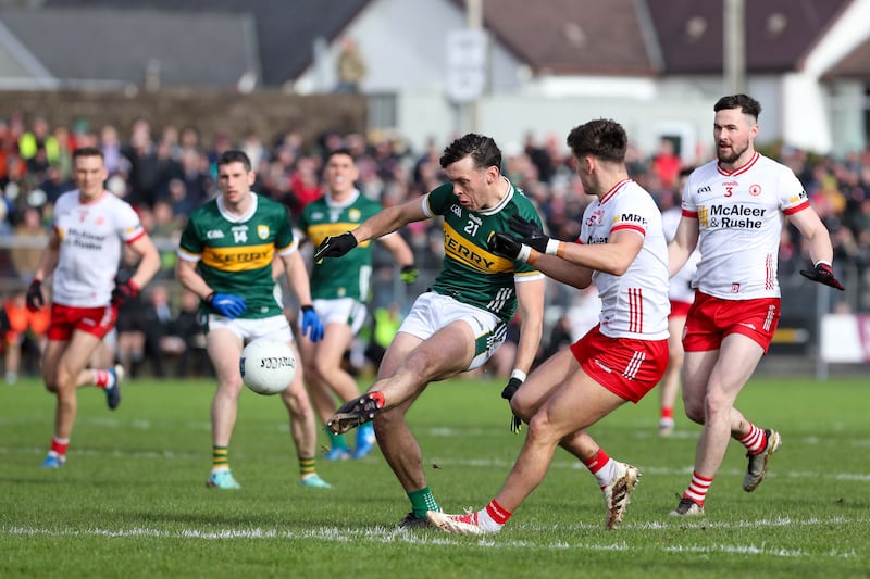 Kerry’s David Clifford scores a point as Tyrone's Michael McKernan challenges. Photograph: Lorcan Doherty/Inpho