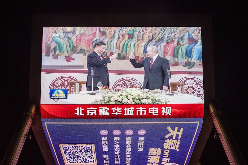 A screen shows Chinese president Xi Jinping raising a glass with Russian president Vladimir Putin in Moscow in March. The war in Ukraine is poisoning relations between Europe and China. Photograph: Wu Hao