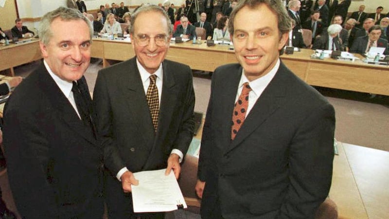 Bertie Ahern, Tony Blair and George Mitchell smiling on April 10th, 1998, after they signed a historic agreement for peace in Northern Ireland, ending a 30-year conflict. Photograph: Dan Chung