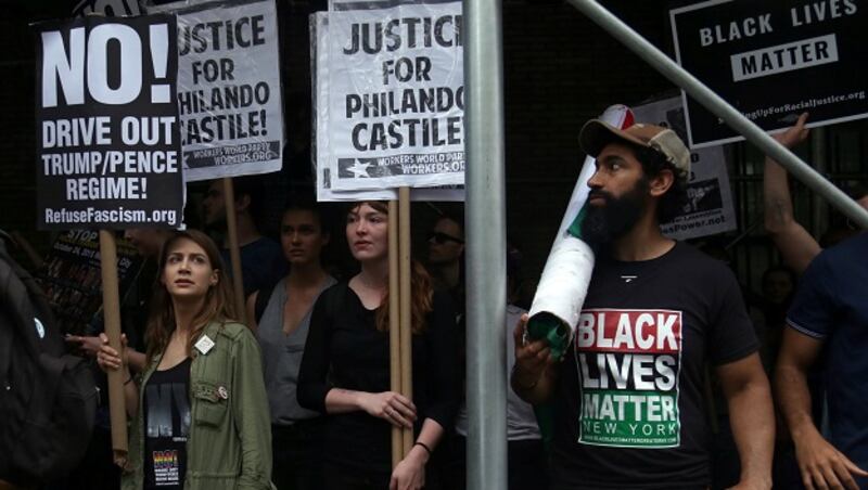 People hold signs in protest after a jury found police officer Jeronimo Yanez not guilty of second-degree manslaughter in the death of Philando Castile in the US this week. Photograph: Bria Webb/Reuters