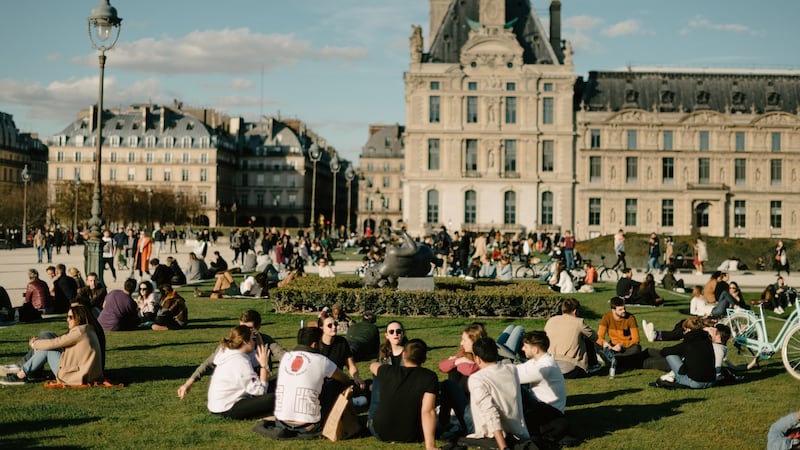 People gather near the Louvre in Paris on  March 15th. Photograph: Dmitry Kostyukov/New York Times