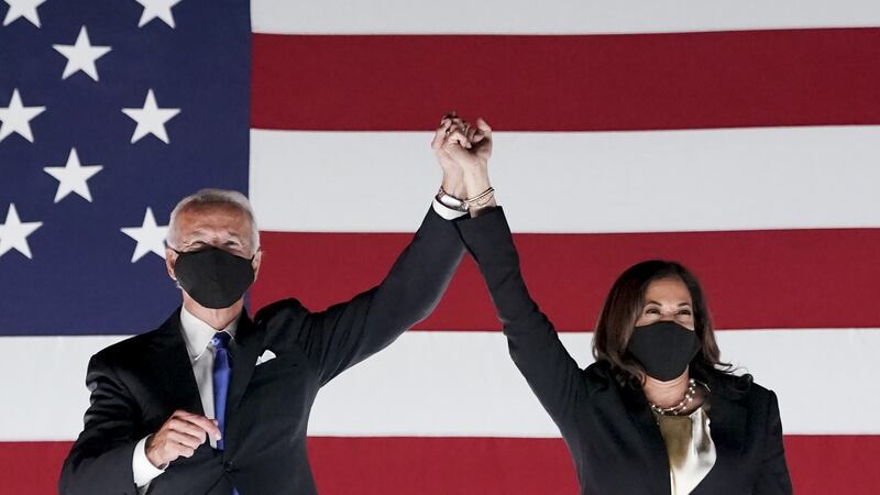 Former vice president Joe Biden, Democratic presidential nominee (left) left, and senator Kamala Harris, Democratic vice presidential nominee, wear protective masks while holding hands outside the Chase Center during the Democratic National Convention in Delaware last night. Photograph: Bloomberg