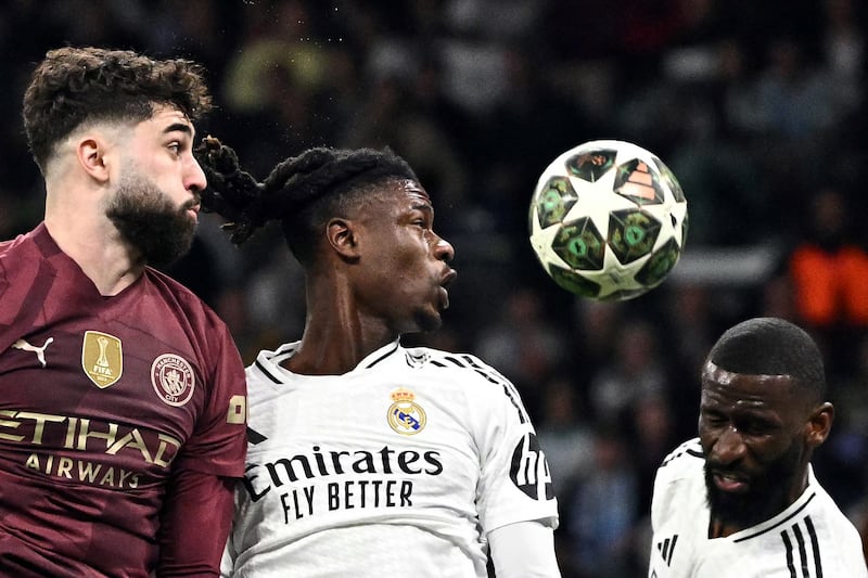 Manchester City's Josko Gvardiol, Real Madrid's Eduardo Camavinga and Antonio Ruediger vie for a header during the Champions League knockout phase play-off. Photograph: Javier Soriano/AFP via Getty Images