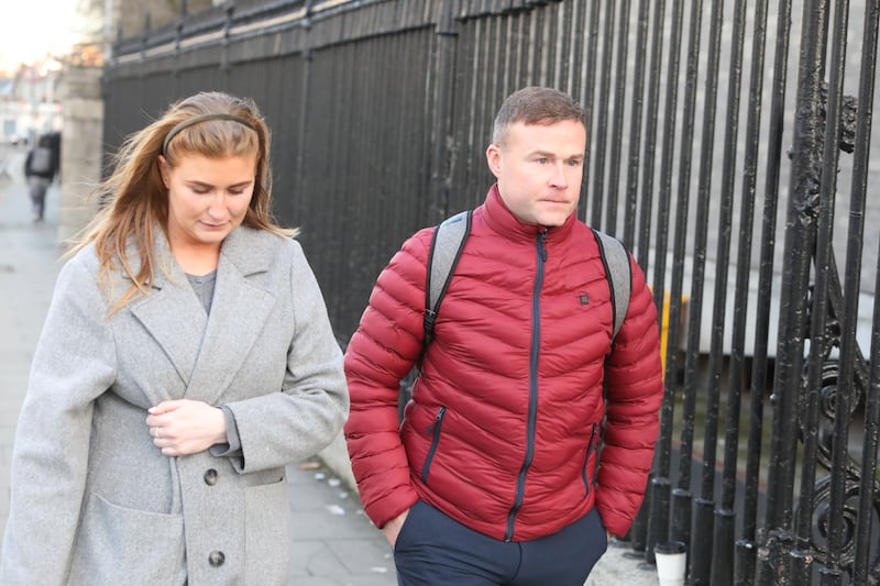 Garda Ronan O Shaughnessy leaving the Four Courts with his girlfriend Garda Aisling Walsh. Photograph: Collins Courts