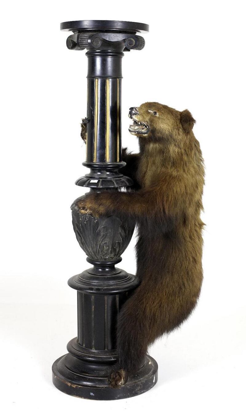 Lot 281, carved pillar with brown bear cub