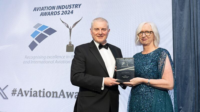 David Usher, awards judge, presents the women in aviation award to  Eleanor Travers, Irish Aviation Authority