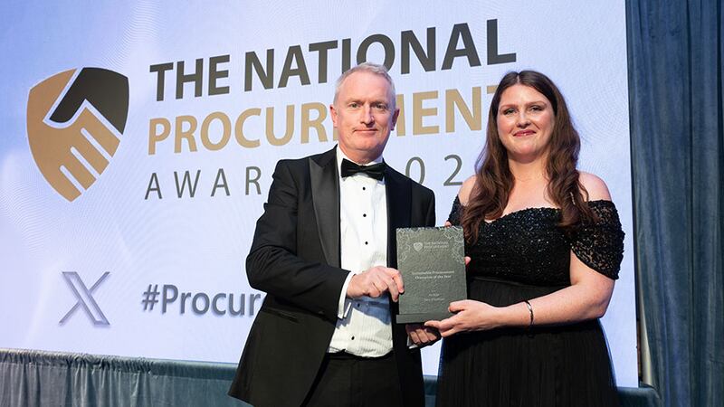 Gary Mander, awards judging coordinator, presents the sustainable procurement champion of the year to Dara O'Sullivan, An Post