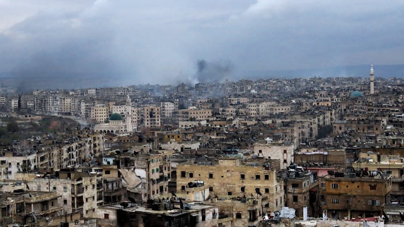 Smoke rises from buildings in Aleppo’s southeastern al-Zabdiya neighbourhood following government strikes on Wednesday. Photograph: Stringer/AFP/Getty Images