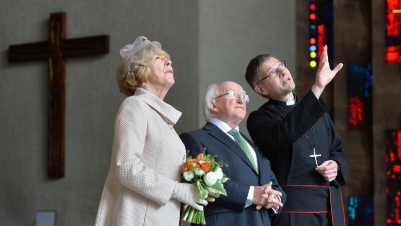 The Very Reverend John Witcombe, Dean of Coventry, showing President Michael D Higgins and his wife Sabina the New Cathedral in Coventry during the final part of the Presidents state visit to Britain. Photograph: Alan Betson/The Irish Times