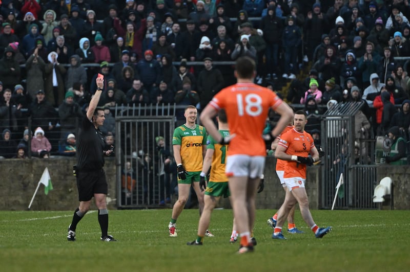 Referee Sean Hudson shows Armagh's Aidan Forker a red card. Photograph: Andrew Paton/Inpho