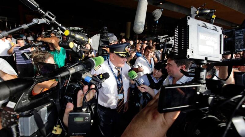 Reporters surround a crew member of Aeroflot’s Moscow-Havana flight as they ask about former spy agency contractor Edward Snowden’s whereabouts, at Havana’s Jose Marti International Airport yesterday. Aeroflot flights from Moscow’s Sheremetyevo airport are currently being closely tracked by media organisations in case Mr Snowden, who revealed details of US surveillance programmes, is on board. Photograph: Desmond Boylan/Reuters