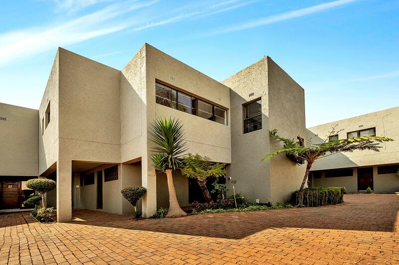 This three-bed house in Johannesburg boasts a large balcony for entertaining and a double garage