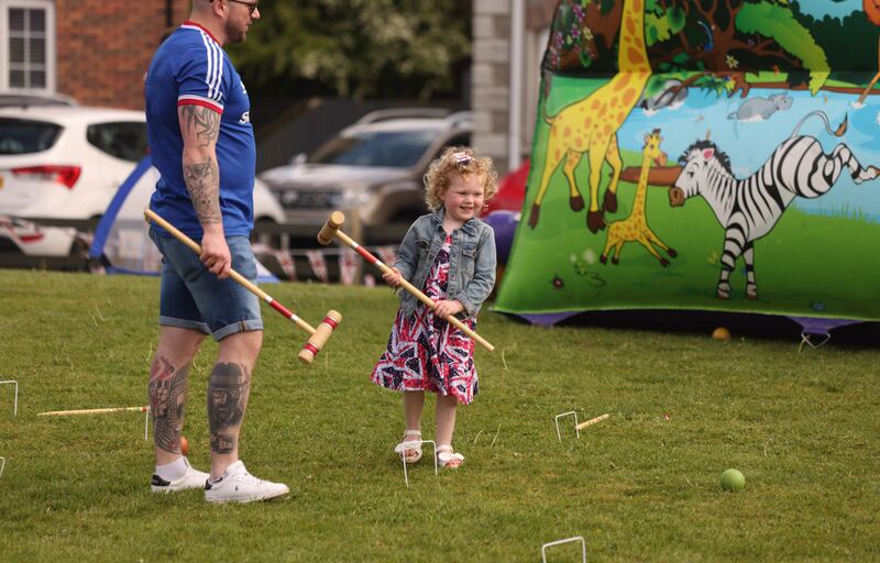 Young and old gather to celebrate the coronation of King Charles III at a street party organised by the community at Ballynacor outside Portadown, Co. Armagh. Photo: Bryan O Brien / The Irish Times 
