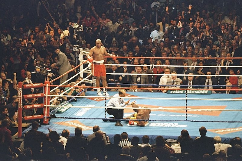 George Foreman wins a round during a bout against Michael Moorer in Las Vegas, Nevada, in November 1994.  Foreman won the fight with a knockout in the 10th round. Photograph: Al Bello/Allsport