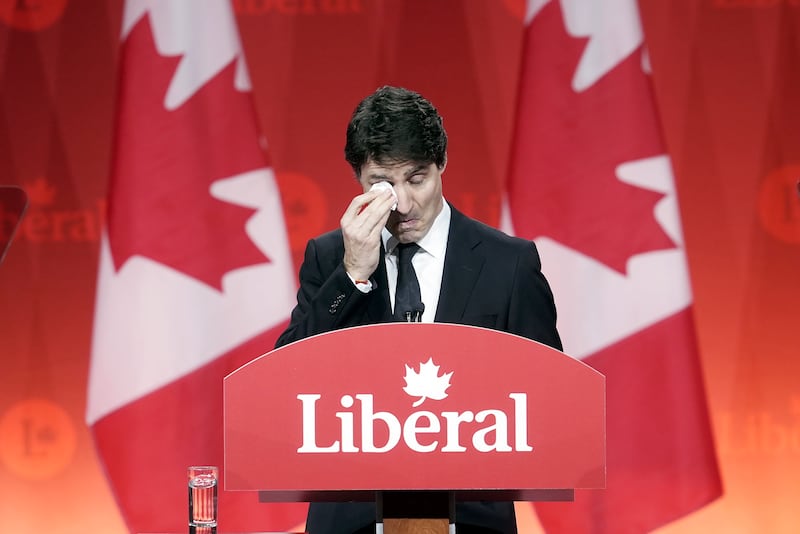 Prime Minister Justin Trudeau wipes away tears as he speaks during the Liberal leadership announcement in Ottawa (Adrian Wyld/The Canadian Press via AP)