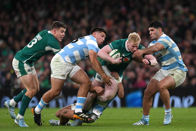 Ireland's Jamie Osborne is tackled by Justo Piccardo and Joaquin Oviedo of Argentina during an Autumn Nations Series match at the Aviva Stadium on November 15th, 2024. Photograph: Charles McQuillan/Getty Images