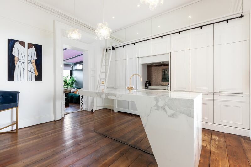 Kitchen: In an imaginative visual trick, one end of the marble island-top seems to float; then you realise the side is mirrored, to reflect the floor. 