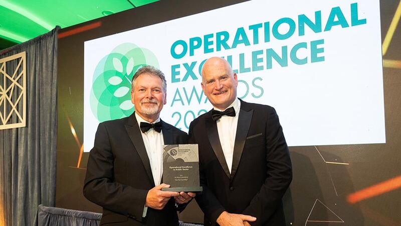 Sean Mc Auliffe, director of specialised services at ISS Ireland, presents the operational excellence in public sector to Brian Clancy, An Post Commerce