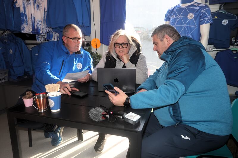 Alan Cantwell (right), Sarah Martlew and Jason Gavin from Moyne Villa FC in Headford, Co Galway look through requests for help