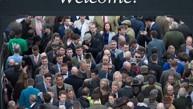 Racegoers pass into the Guinness bar area at  Cheltenham on the first day of the 2017 festival. Photograph:  Matt Cardy/Getty Images