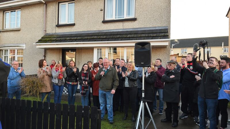 A vigil held at the home of  Kevin Campbell (centre) in Creggan after his car was set on fire in the driveway.    Photograph:Trevor McBride