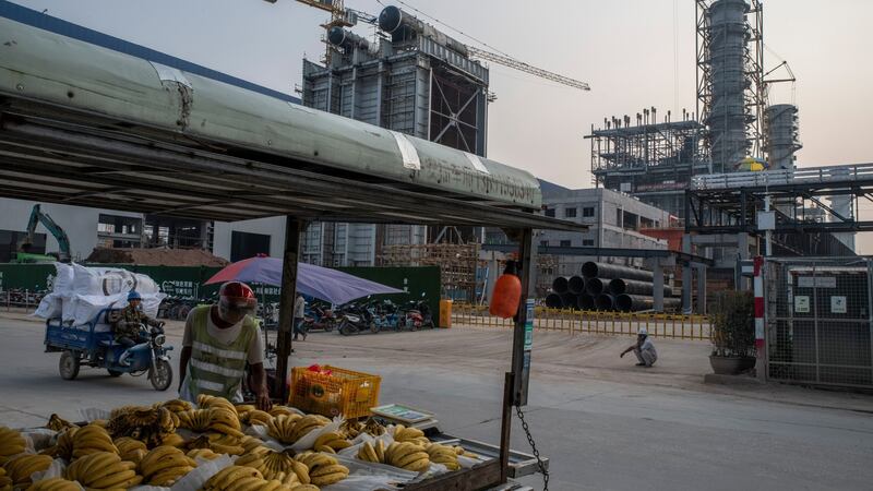 A gas-fired power plant, background, under construction in Dongguan, China, last month. Photograph: Gilles SabriŽ/The New York Times