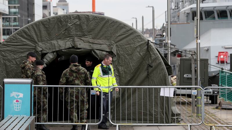 Defence forces tents have been set up alongside the LÉ Samuel Beckett in Dublin ahead of it becoming  a testing centre for Covid-19. Photograph: Brian Lawless/PA Wire