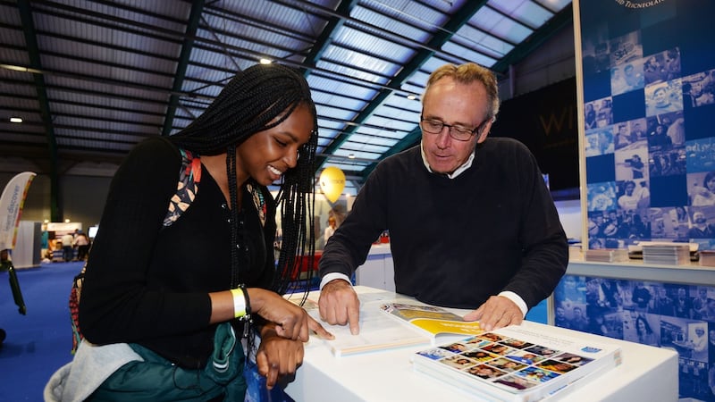 Olamide Alao from Sancta Maria College speaking to Frank Costello, head of administration DIT about courses available to prospective students at the the Irish Times Higher Options Conference in the RDS. Photograph: Alan Betson / The Irish Times