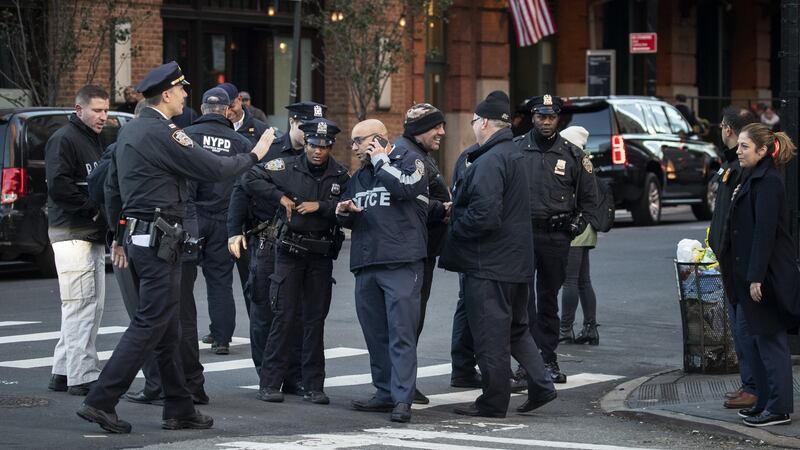 Law enforcement officials gather near the scene of where a suspected  bomb was found early on Thursday morning at Robert De Niro’s TriBeCa Grill restaurant in New York. Photograph: Drew Angerer/Getty Images