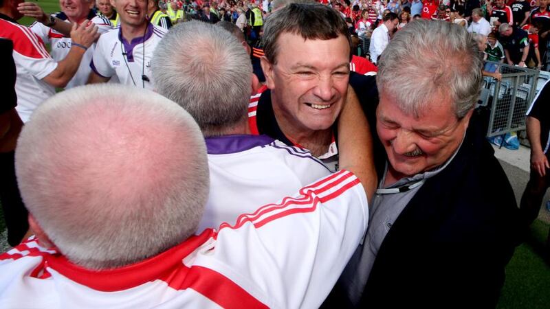 Cork manager Jimmy Barry-Murphy celebrates with his back room team and Cork County Board chairman Bob Ryan after beating Limerick. Photograph: James Crombie/Inpho