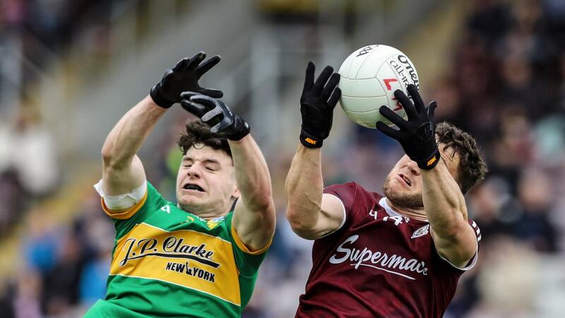 Galway’s Damien Comer and Donal Casey of Leitrim. Photograph: Lorraine O’Sullivan/Inpho