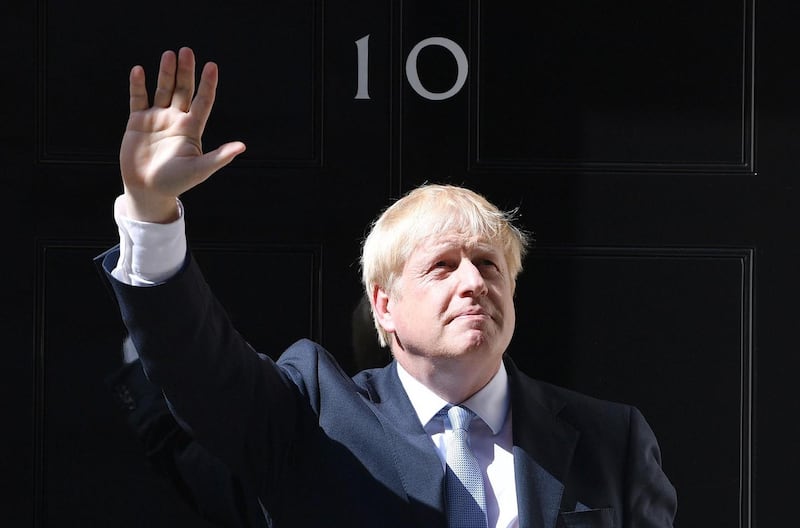 Boris Johnson waves from the door of Number 10, Downing Street after speaking to the media on Wednesday. Photograph:  Jeff J Mitchell/Getty