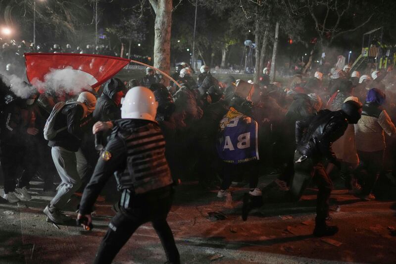 Riot police clash with protesters during a demonstration against the arrest of Ekrem Imamoglu (Francisco Seco/AP)