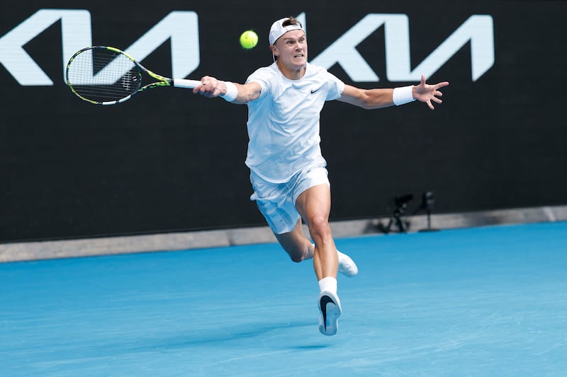 Denmark's Holger Rune hits a return against Italy's Jannik Sinner. Photograph: Martin Keep/AFP via Getty Images