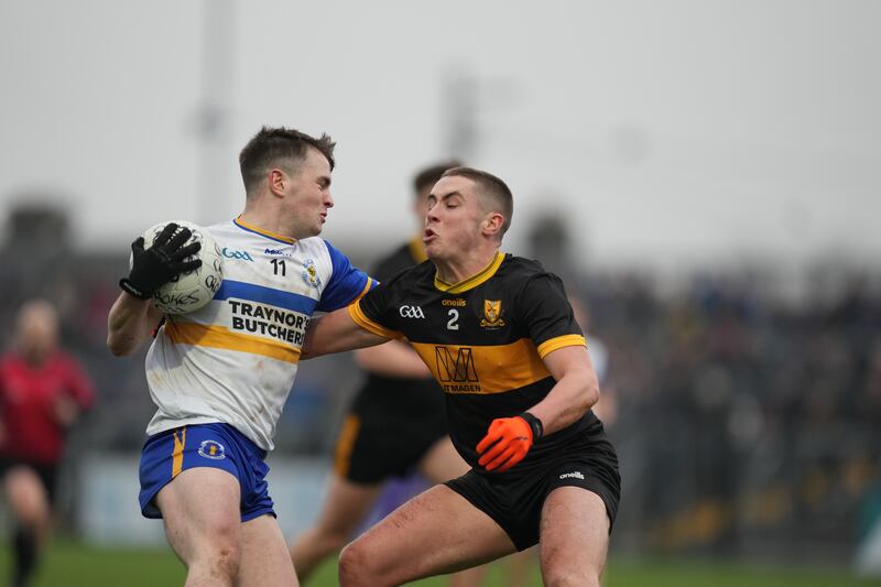 Ruairi Canavan of Errigal Ciarán takes on Evan Looney of Dr Crokes. Photograph: James Lawlor/Inpho