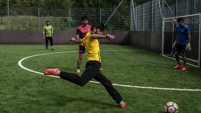 A group of Kurdish men play soccer at Carrick’s Aura Leisure Center in Carrick-on-Shannon. Photograph: Paulo Nunes dos Santos