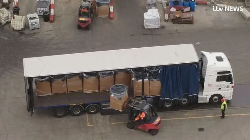 ITV News cameras film pallets piled with unwanted goods being unloaded at a waste recycling site near to Amazon’s Dunfermline warehouse. Photograph: ITV News