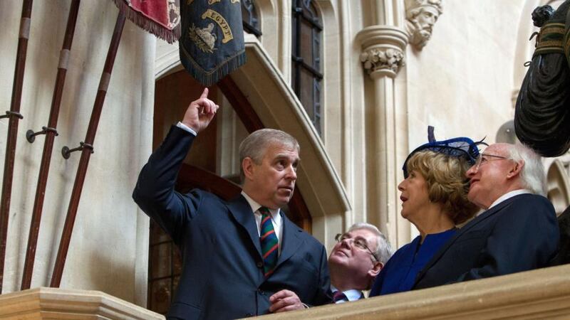 The Duke of York shows President Michael D Higgins, accompanied by his wife Sabina Higgins, the Colours of the Disbanded Irish Regiments in the Grand Stairs at Windsor Castle today. Photograph: Steve Parsons/PA