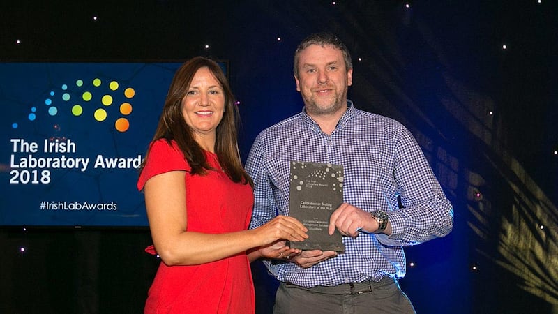 Matt Moran, Director, BioPharmaChem Ireland presents the Calibration or Testing Laboratory of the Year award to the Tom McGuinn, LotusWorks.