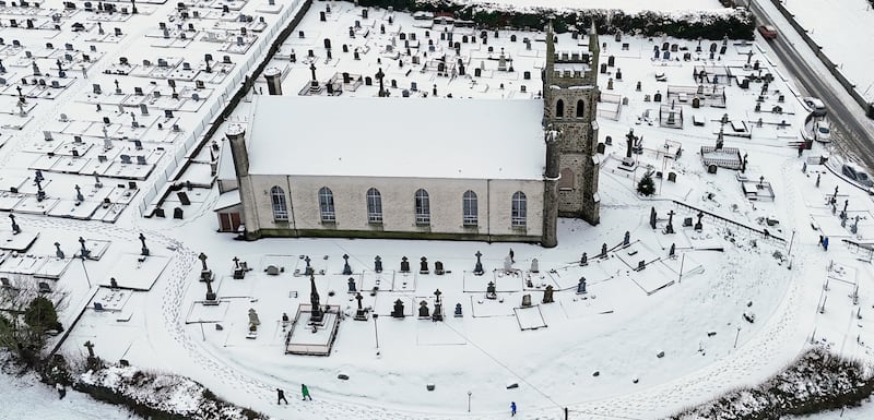 People make their way through snow to Mass at Holy Cross Catholic Church in Killeshin, County Laois, Ireland. Picture date: Sunday January 5, 2025. PA Photo. See PA story WEATHER Winter Ireland. Photo credit should read: Niall Carson/PA Wire