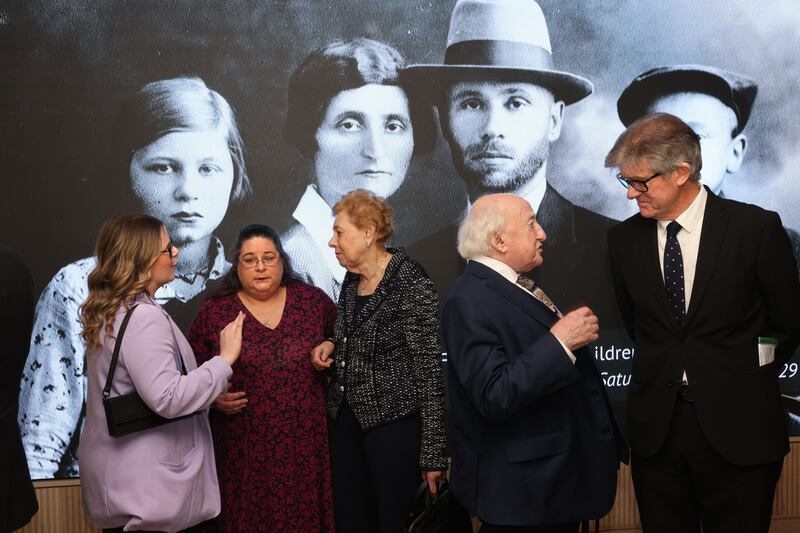 President Michael D. Higgins with Chair of Holocaust Education Ireland, Prof. Thomas O’Dowd. (right) and Irish Holocust survivor Suzi Diamond (81) (center) with second-generation survivor Nichola Zinn-Collis and her daughter Molly (left) at the National Holocaust Memorial Day commemoration  and The annual ceremony honours the memory of all who perished in the Holocaust including six million Jews, and millions persecuted because of their ethnicity, disability, sexual orientation, political affiliations, or religious beliefs. The ceremony included readings, survivors’ recollections, candle-lighting, and music. It takes place on the Sunday closest to January 27 - the day Auschwitz concentration camp with liberated in 1945. The event at Dublin Royal Convention Centre was run by Holocaust Education Ireland (HEI) in association with the Department of Children, Equality, Disability, Integration and Youth. Photograph: Dara Mac Donaill / The Irish Times