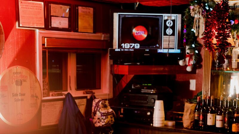 The Side Door Saloon in Petoskey, Michigan. Larry Cummings, who died of Covid-19 in March  at the age of 76, liked to visit the bar after work on Mondays. Photograph: Lyndon French/New York Times