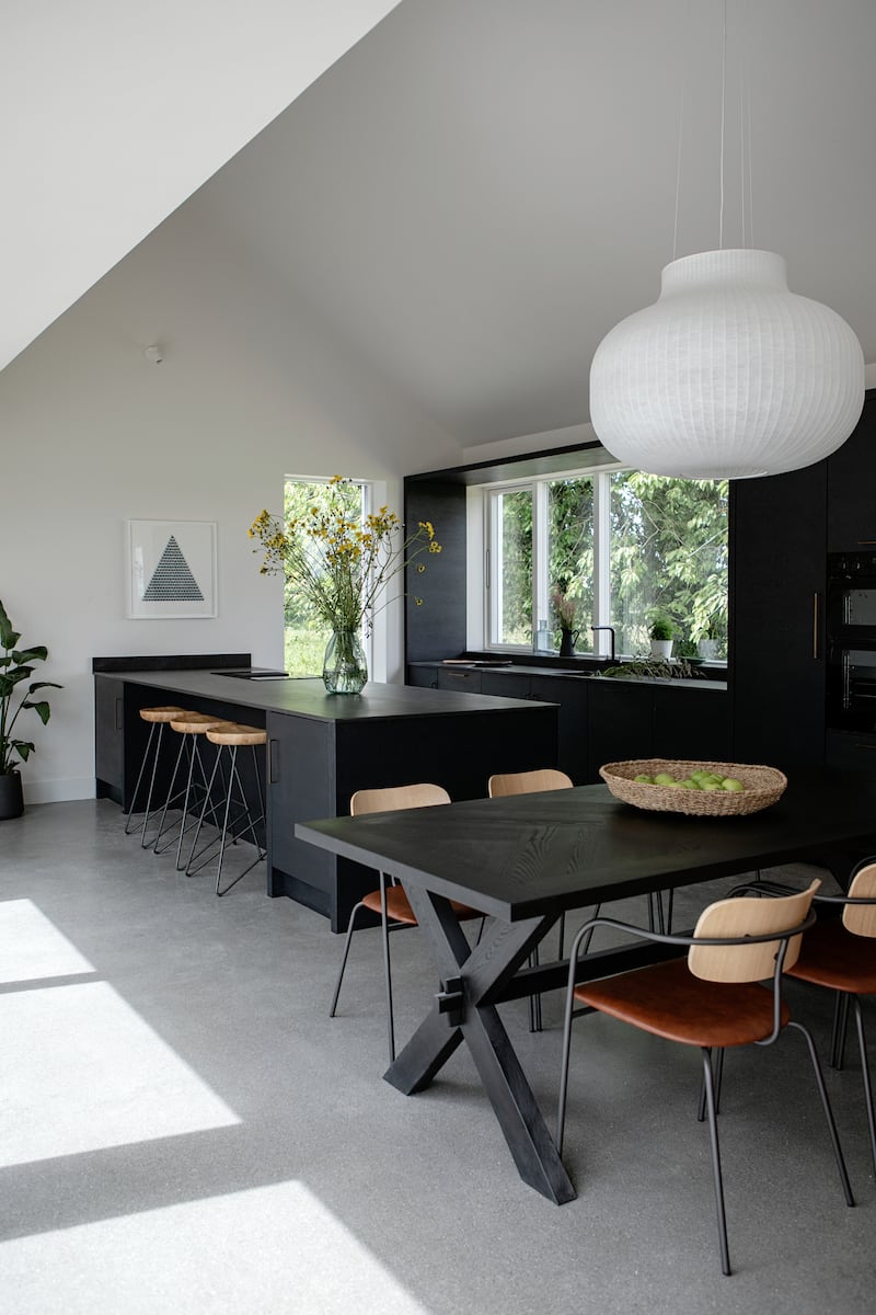 Pic: A monochrome kitchen where the glazing is aligned to the height of the kitchen cabinetry to create a sleeker overall look / Ruth/Maria