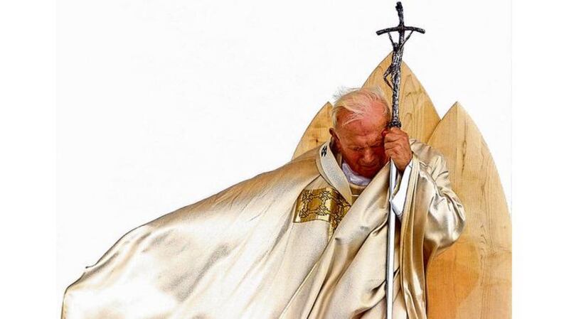 Good and bad?: John Paul II. photographs: ap and gabriel bouys/afp